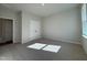 Bright, carpeted bedroom featuring a window, neutral walls, and a double-door closet at 804 Hillfarm Dr, Wake Forest, NC 27587