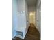 Hallway with coat rack and bench leading to a full bathroom with glass-enclosed shower at 804 Hillfarm Dr, Wake Forest, NC 27587