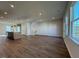 Open concept living room featuring recessed lighting, hardwood floors, and an adjoined island kitchen at 804 Hillfarm Dr, Wake Forest, NC 27587