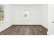 Bedroom features new floors and a window, perfect for relaxing and unwinding at 824 S Tillery St, Rocky Mount, NC 27803