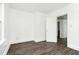 This bedroom features an open door and new floors, creating a cozy atmosphere at 824 S Tillery St, Rocky Mount, NC 27803