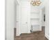 Hallway with storage, built-in shelves, and three doorways, offering easy transitions at 824 S Tillery St, Rocky Mount, NC 27803