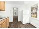 Bright kitchen features a refrigerator and window providing ample natural light at 824 S Tillery St, Rocky Mount, NC 27803