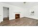 Bright living room featuring refinished floors and a beautiful fireplace perfect for the holidays at 824 S Tillery St, Rocky Mount, NC 27803