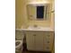 Bathroom with white vanity, a large mirror, and a toilet with wood-look floors at 928 Magnolia Ridge Way, Fuquay Varina, NC 27526