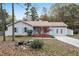 Charming single-story home with light gray siding, blue shutters and door, and a well-maintained front yard at 928 Magnolia Ridge Way, Fuquay Varina, NC 27526