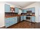 Galley kitchen featuring stainless appliances and copper-colored backsplash at 928 Magnolia Ridge Way, Fuquay Varina, NC 27526