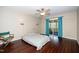 The main bedroom features a ceiling fan, door to the balcony, and an interesting color scheme at 928 Magnolia Ridge Way, Fuquay Varina, NC 27526