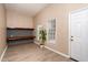 Home office setup with shelving and two windows at 928 Magnolia Ridge Way, Fuquay Varina, NC 27526