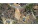 Aerial view of a residential lot showing the surrounding neighborhood, trees, and new home at 0 Jasmine Rd, Fuquay Varina, NC 27526