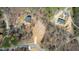 A new construction home and adjacent lot with circle driveway are seen from an aerial view during springtime at 0 Jasmine Rd, Fuquay Varina, NC 27526