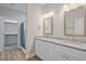 Bathroom featuring double vanity with granite countertop, modern fixtures, and a walk-in shower at 0 Jasmine Rd, Fuquay Varina, NC 27526