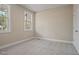 Bedroom featuring two windows and neutral carpet at 0 Jasmine Rd, Fuquay Varina, NC 27526