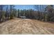 View of a house on an empty lot surrounded by trees, ready for someone to build their dream home at 0 Jasmine Rd, Fuquay Varina, NC 27526