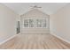 Bright and airy living room featuring hardwood floors, a ceiling fan, and sliding glass doors to a patio at 0 Jasmine Rd, Fuquay Varina, NC 27526