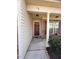 Inviting entryway featuring a covered porch with decorative lighting and stylish front door at 78 Florence Dr, Clayton, NC 27527