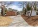 Spacious backyard featuring an outbuilding and a brick exterior with a cozy porch at 100 Royall Rd, Oxford, NC 27565