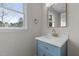 Bathroom with a vanity, stone countertop and a large window showcasing the exterior view at 100 Royall Rd, Oxford, NC 27565