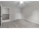 Freshly painted bedroom with ceiling fan, updated carpets, and an open doorway at 100 Royall Rd, Oxford, NC 27565