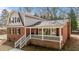 Charming brick two-story home with covered front porch and classic black shutters at 100 Royall Rd, Oxford, NC 27565