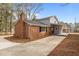 Home exterior showcasing brick and siding with a covered porch at 100 Royall Rd, Oxford, NC 27565