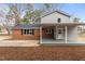 Home exterior showcasing brick and siding with a covered back porch at 100 Royall Rd, Oxford, NC 27565
