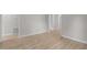 Hallway featuring light colored walls and wood flooring at 100 Royall Rd, Oxford, NC 27565