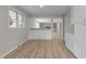 Open-concept hallway showcases wood flooring and white cabinets with modern style at 100 Royall Rd, Oxford, NC 27565