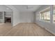 Spacious living room with a fireplace, built-in shelves and wood-look flooring at 100 Royall Rd, Oxford, NC 27565