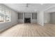 Bright living room features a fireplace with built-in shelves and wood-look flooring at 100 Royall Rd, Oxford, NC 27565