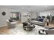Living room with a modern sofa, chairs, and an area rug at 100 Royall Rd, Oxford, NC 27565