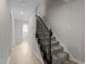 A staircase with newly installed floors leading to the upper level of the home at 100 Royall Rd, Oxford, NC 27565