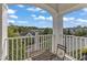 Peaceful balcony overlooking a landscaped community with trees and neighboring homes at 10210 Sablewood Drive # 112, Raleigh, NC 27617