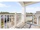 Private balcony with views of the neighborhood and a sturdy white railing at 10210 Sablewood Drive # 112, Raleigh, NC 27617