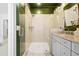 This newly remodeled bathroom has a large walk-in shower and granite countertops at 10210 Sablewood Drive # 112, Raleigh, NC 27617