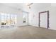 Spacious bedroom with neutral carpet, a private balcony, and ensuite bathroom at 10210 Sablewood Drive # 112, Raleigh, NC 27617