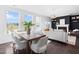 Open dining and living space filled with natural light, fireplace and comfortable seating at 10210 Sablewood Drive # 112, Raleigh, NC 27617