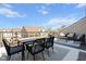 Expansive outdoor patio with a dining table, comfortable seating, and views of the surrounding neighborhood at 10210 Sablewood Drive # 112, Raleigh, NC 27617