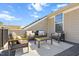 Inviting outdoor patio with comfortable seating and sunny views of the neighborhood at 10210 Sablewood Drive # 112, Raleigh, NC 27617