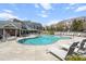 Resort-style community pool with ample lounge chairs and a clubhouse at 10210 Sablewood Drive # 112, Raleigh, NC 27617