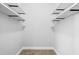 This walk-in closet offers an abundance of storage with wrap around shelving at 10210 Sablewood Drive # 112, Raleigh, NC 27617