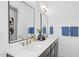 Spacious bathroom with double vanity, framed mirrors, designer fixtures, and sleek cabinets at 1028 Zelkova Ln, Chapel Hill, NC 27517
