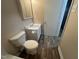 Bathroom featuring a mirror over the sink and wood-look flooring at 103 Beam Cir, Louisburg, NC 27549