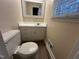 Bathroom featuring a mirror over the sink and a window at 103 Beam Cir, Louisburg, NC 27549