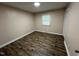 Bedroom featuring neutral walls, a window, and wood-look flooring at 103 Beam Cir, Louisburg, NC 27549