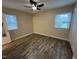 Bedroom featuring a ceiling fan and two windows providing natural light at 103 Beam Cir, Louisburg, NC 27549