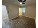 Bedroom featuring a ceiling fan and two windows providing natural light at 103 Beam Cir, Louisburg, NC 27549