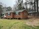 Exterior view showing the side and backyard with a shed at 103 Beam Cir, Louisburg, NC 27549