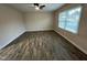 Spacious living room with lots of natural light and attractive wood-look flooring at 103 Beam Cir, Louisburg, NC 27549