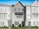 Charming townhome featuring a modern gray facade and inviting curb appeal at 1030 Zelkova Ln, Chapel Hill, NC 27517